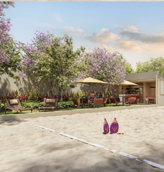 Área de convivência do T.O.M. Paraíso com espreguiçadeiras, jardim florido e espaço gourmet ao lado da quadra de areia
